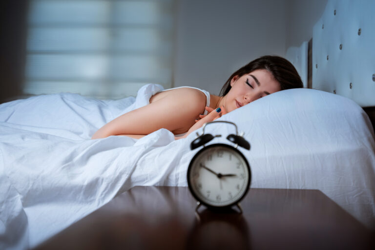 Woman is sleeping in bed at night